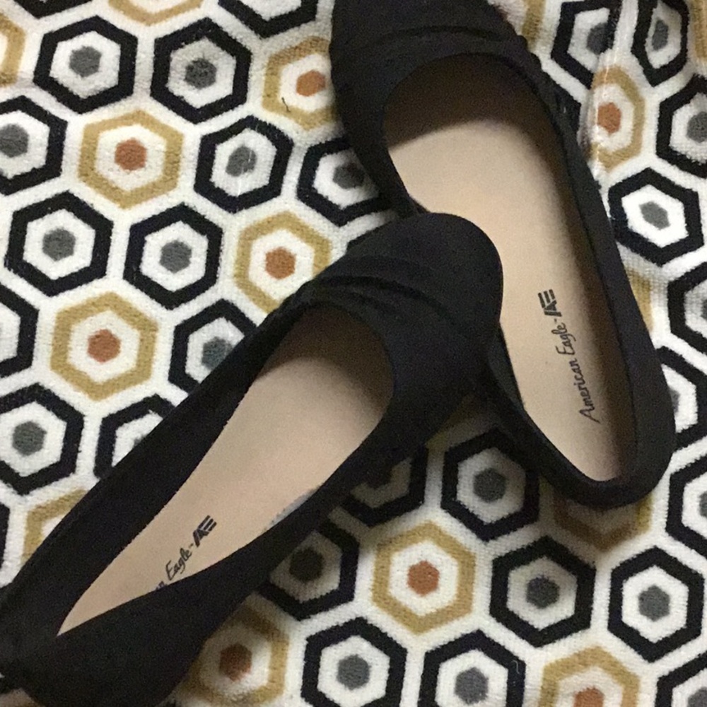 Black flats with a small,cute design in the front